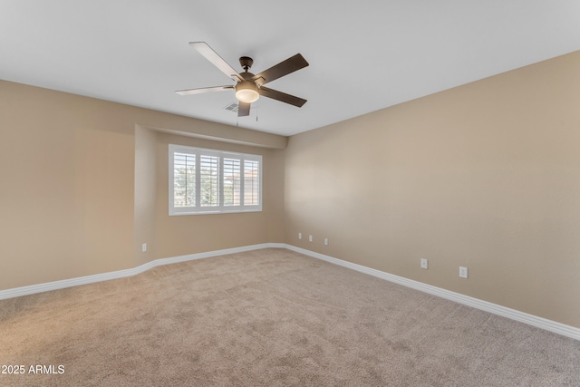 unfurnished room featuring baseboards, a ceiling fan, carpet flooring, and visible vents