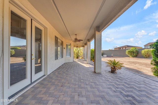 view of patio featuring ceiling fan, french doors, and a fenced backyard