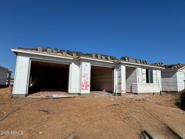 property in mid-construction with a garage