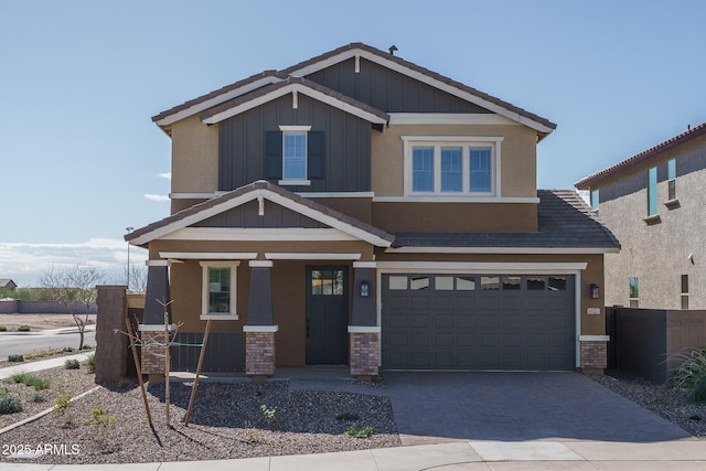 craftsman-style home with covered porch and a garage