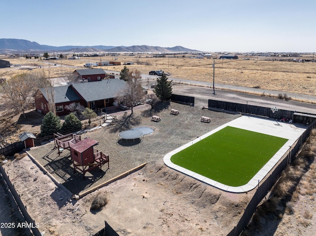 birds eye view of property with a rural view and a mountain view