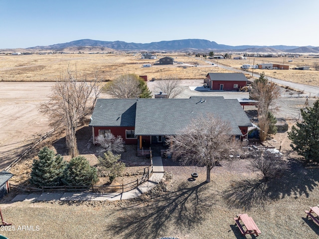 bird's eye view featuring view of desert, a mountain view, and a rural view