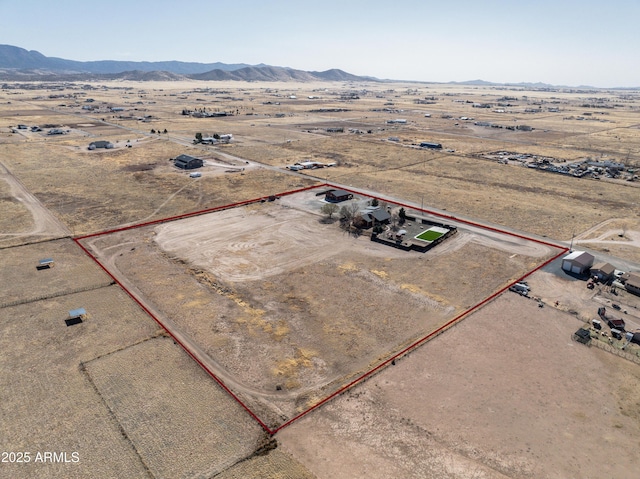 aerial view featuring a rural view, a mountain view, and view of desert