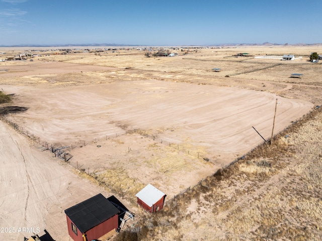 aerial view featuring view of desert, a rural view, and a mountain view