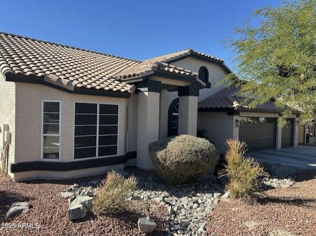 view of side of property with a garage