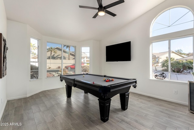 game room with ceiling fan, vaulted ceiling, and billiards