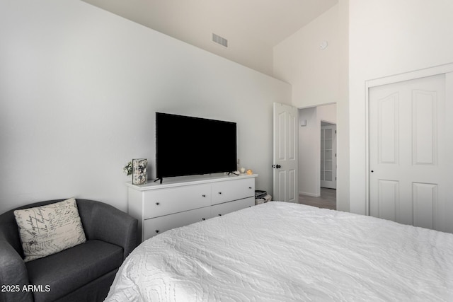 bedroom featuring vaulted ceiling and a closet