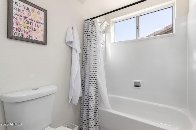 bathroom with shower / bath combo and toilet