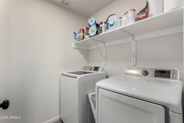 laundry room featuring independent washer and dryer