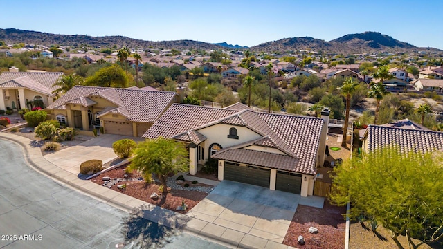 birds eye view of property featuring a mountain view