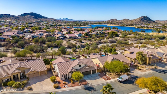 aerial view featuring a water and mountain view