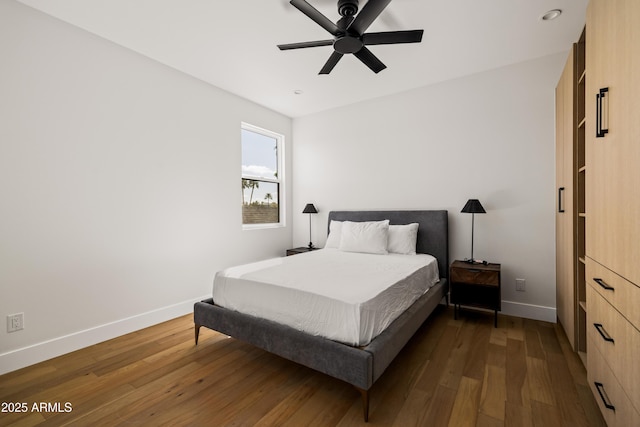 bedroom featuring ceiling fan, baseboards, wood finished floors, and recessed lighting