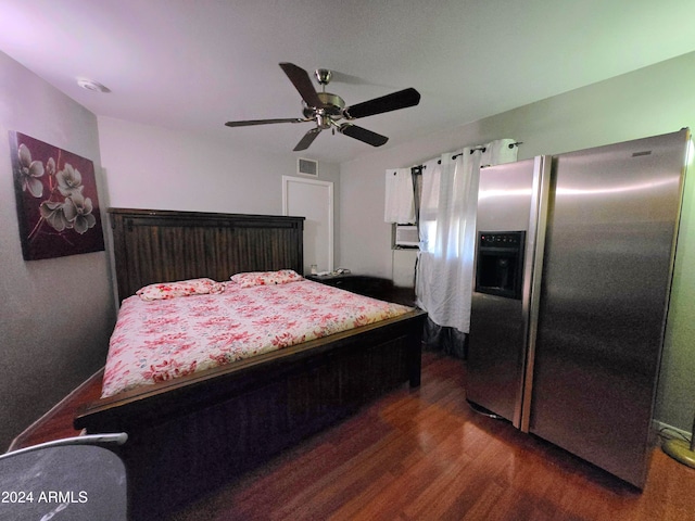 bedroom featuring stainless steel refrigerator with ice dispenser, ceiling fan, and dark hardwood / wood-style floors