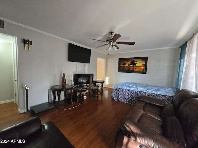 bedroom featuring wood-type flooring, ceiling fan, and crown molding