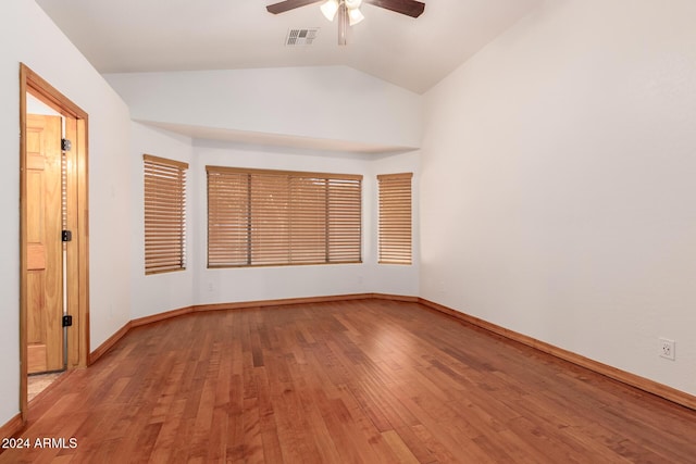 unfurnished room featuring ceiling fan, hardwood / wood-style floors, and lofted ceiling