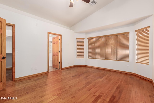 spare room featuring ceiling fan, light hardwood / wood-style flooring, and high vaulted ceiling