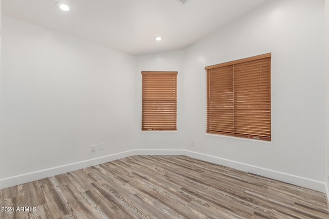 spare room featuring hardwood / wood-style flooring