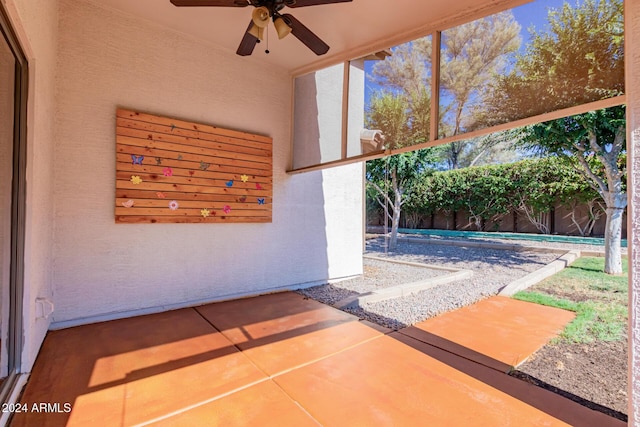 view of patio featuring ceiling fan