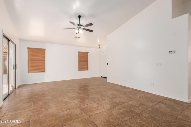 unfurnished room with ceiling fan, tile patterned flooring, and a healthy amount of sunlight