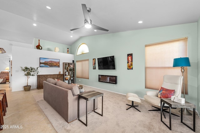 living room with lofted ceiling, ceiling fan, a glass covered fireplace, and recessed lighting