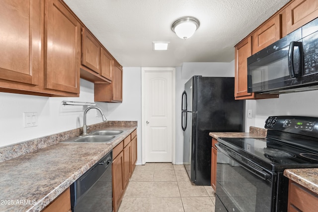 8125 N 32nd Dr, Phoenix, AZ 85051 - kitchen featuring black appliances, a sink, brown cabinets, and light tile patterned flooring