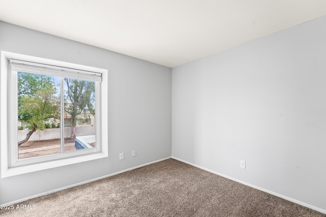 8125 N 32nd Dr, Phoenix, AZ 85051 - unfurnished room featuring carpet flooring and baseboards