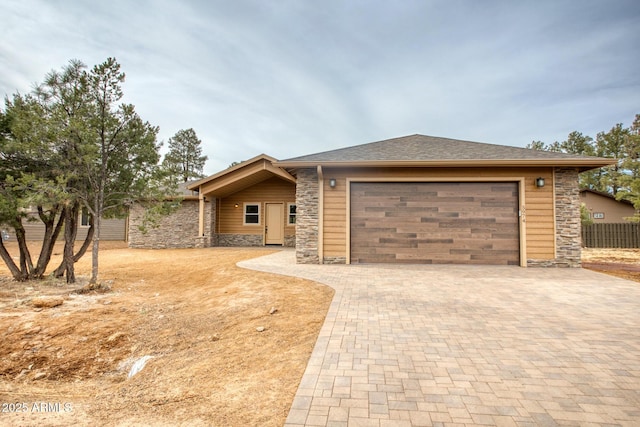 5974 E Elk Spgs, Lakeside, AZ 85929 - view of front facade featuring stone siding, decorative driveway, and an attached garage