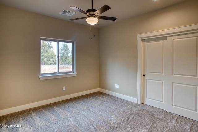 5974 E Elk Spgs, Lakeside, AZ 85929 - unfurnished bedroom featuring carpet flooring, baseboards, a closet, and a ceiling fan