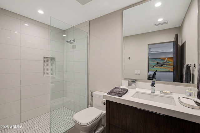 bathroom with visible vents, toilet, walk in shower, vanity, and recessed lighting