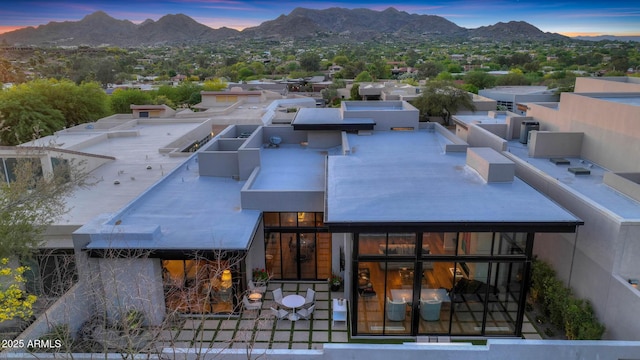 birds eye view of property with a mountain view