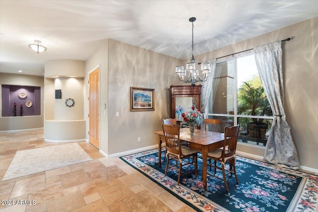 dining room with a notable chandelier