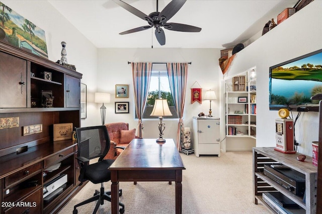 carpeted office space with ceiling fan