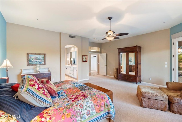 carpeted bedroom featuring ensuite bath, access to outside, and ceiling fan