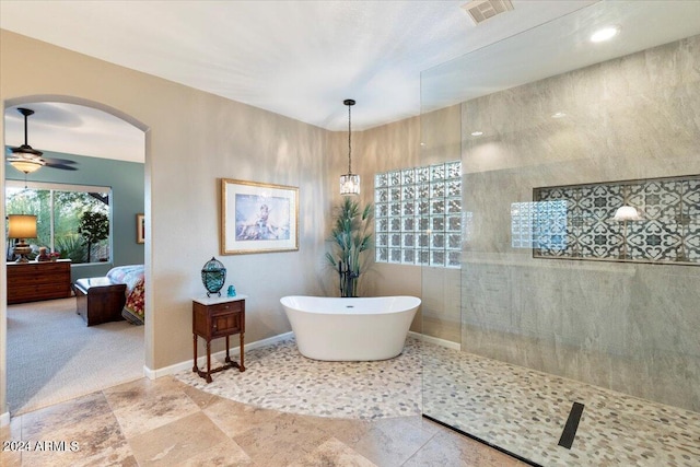 bathroom featuring separate shower and tub and ceiling fan