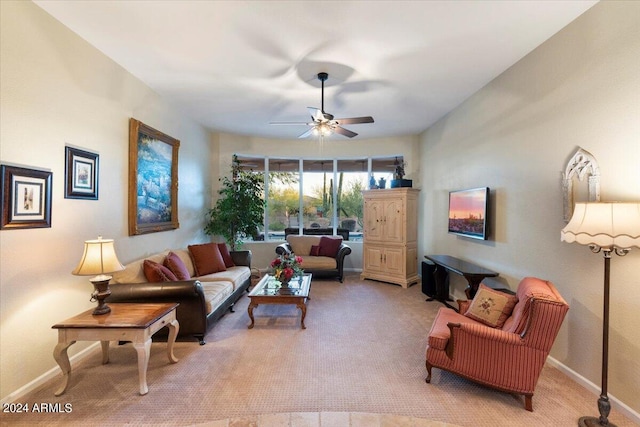 living room with light colored carpet and ceiling fan