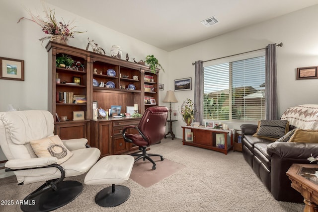 home office with visible vents and light colored carpet