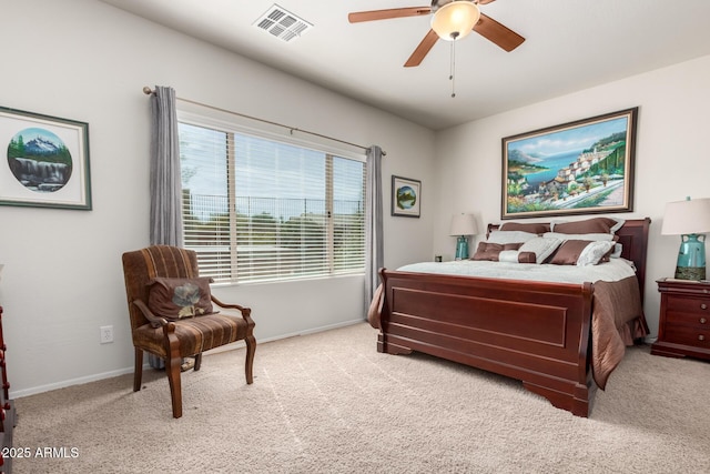 bedroom featuring baseboards, a ceiling fan, visible vents, and light colored carpet