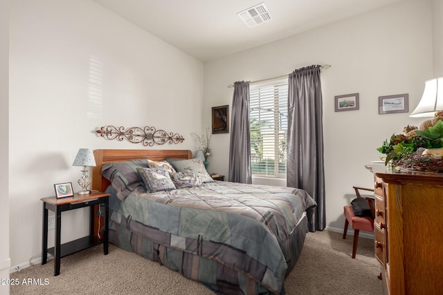 bedroom with light carpet, visible vents, and baseboards