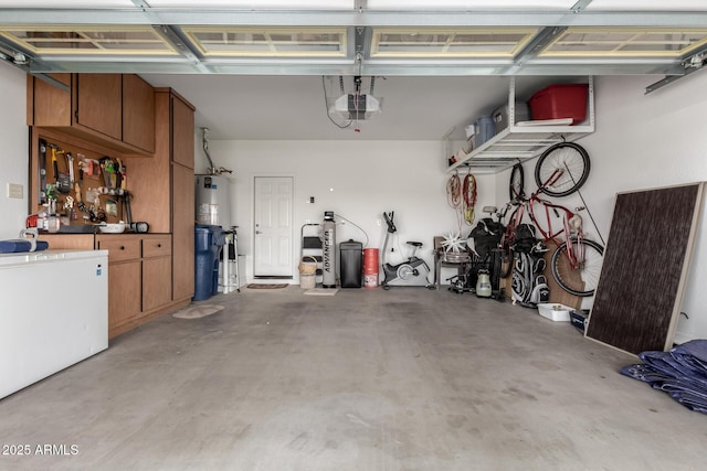 garage featuring a garage door opener and fridge