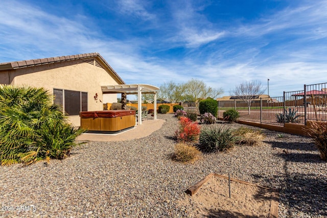 view of yard with a fenced backyard, a patio, a hot tub, and a pergola