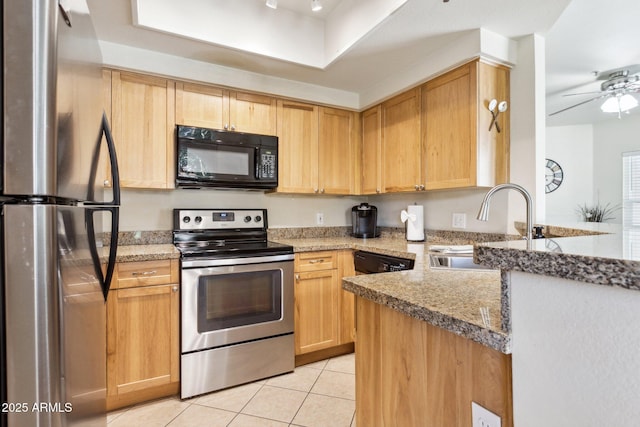 9450 E Becker Ln Unit 2067, Scottsdale, AZ 85260 - kitchen featuring stainless steel appliances, light tile patterned flooring, a ceiling fan, light stone counters, and light brown cabinets