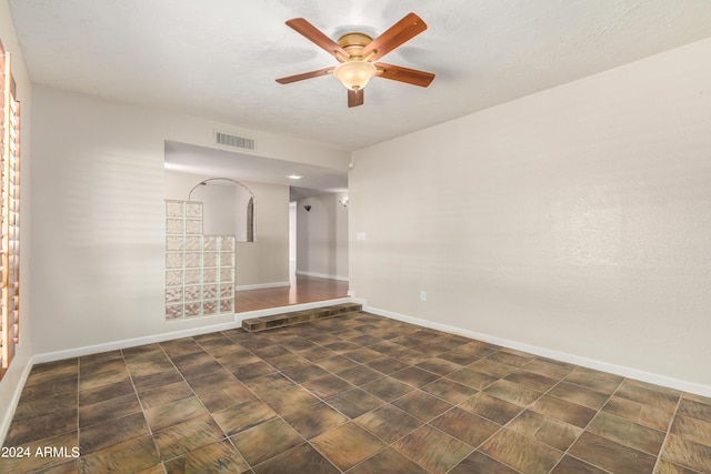 unfurnished room featuring ceiling fan