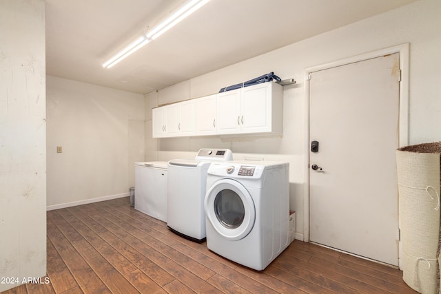 laundry room with cabinets and washing machine and clothes dryer