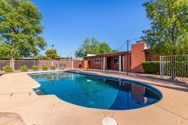 view of pool featuring a patio