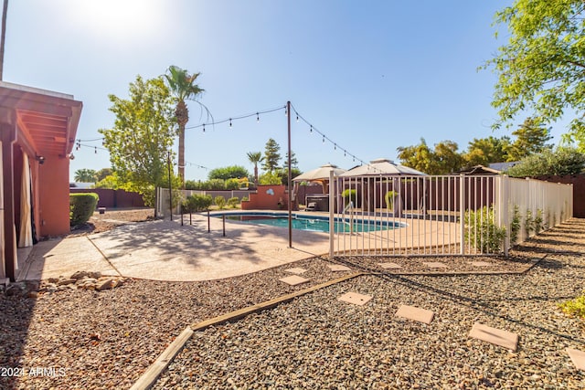 view of swimming pool featuring a patio area