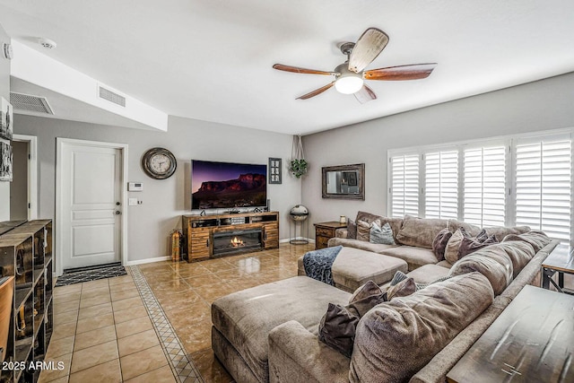 tiled living room featuring ceiling fan