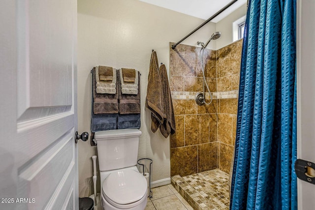 bathroom with curtained shower, tile patterned floors, and toilet