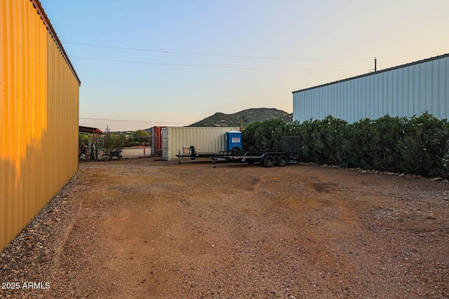 yard at dusk with a mountain view