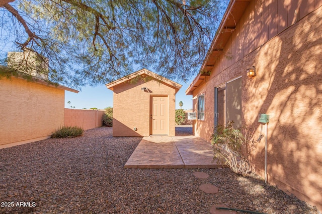 view of yard with a patio, cooling unit, and a shed