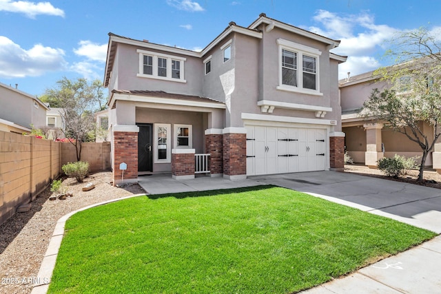 view of front of property with stucco siding, driveway, fence, an attached garage, and brick siding